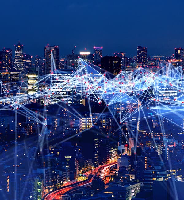 City at night with streams of lights all within the sky