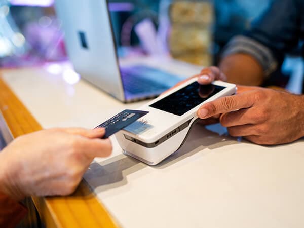 Business Fiber broadband Features 600x450 Person scanning credit card with a POS card reader