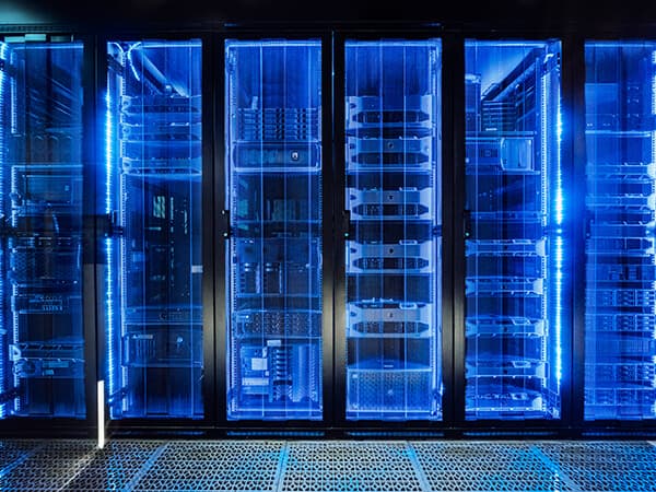 Partners Data Center Connectivity Features 600x450 Blue lighted up racks in data center