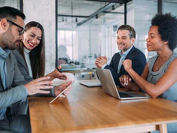 Partners Network Advantage Features 600x450 People in conference room collaborating